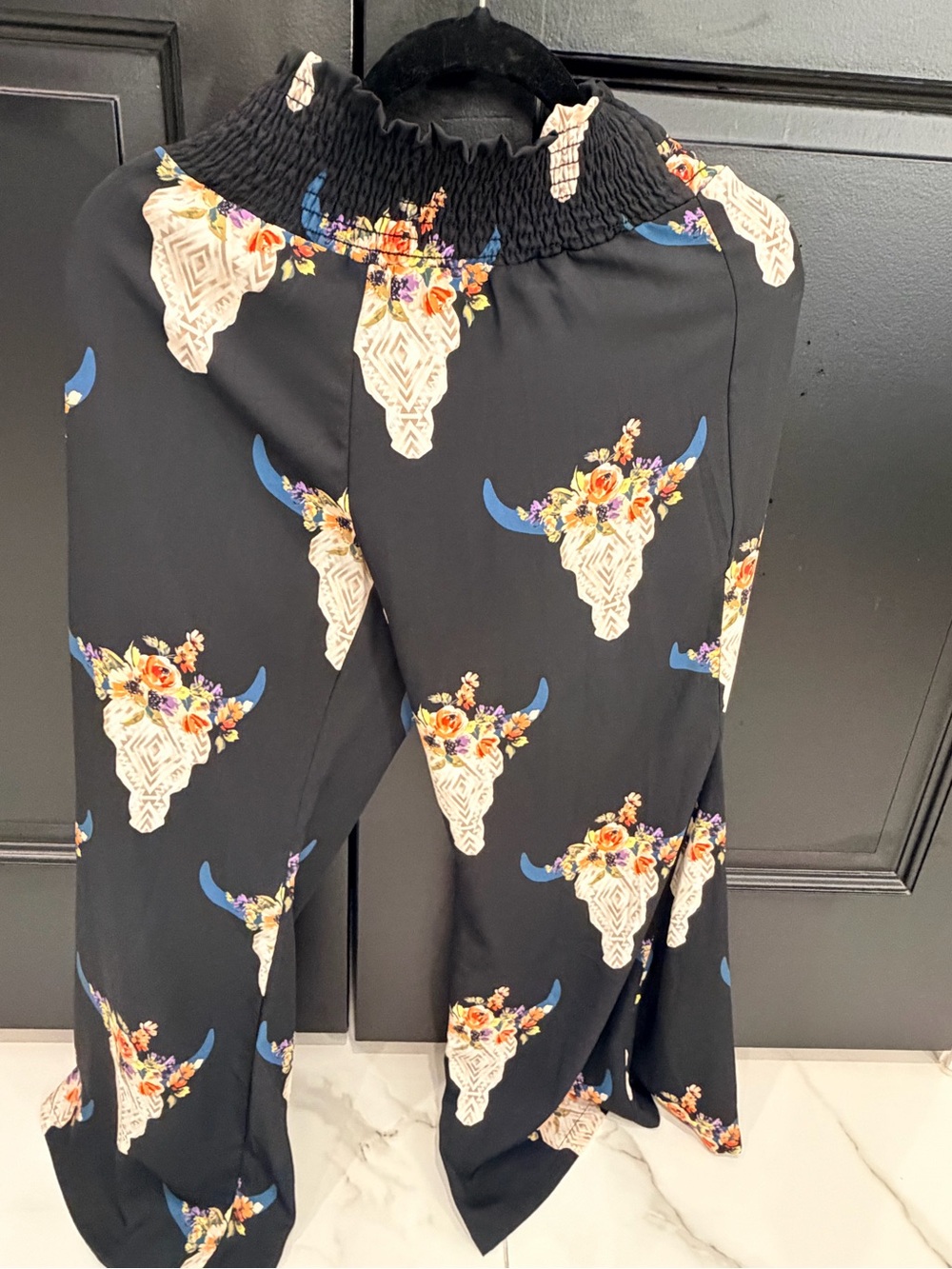Altar'd State Black Wide-Leg Pants with Cream Bull Skull & Blue Horns.